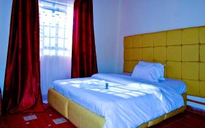 Postel nebo postele na pokoji v ubytování Rembo Homestay Migori