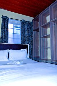 Postel nebo postele na pokoji v ubytování Rembo Homestay Migori