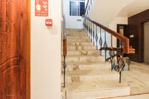 a stairway in a building with a stair case at Sakthi Grand in Erode