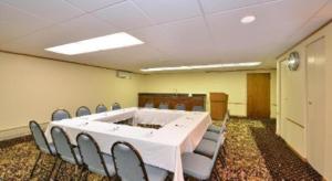 a conference room with a white table and chairs at Days Inn by Wyndham St. Charles IL in Saint Charles +72 photos