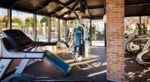 a gym with several exercise bikes in a building at Days Inn by Wyndham St. Charles IL in Saint Charles