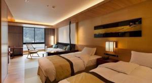 Postel nebo postele na pokoji v ubytování Gifu Grand Hotel + 256 fotografií