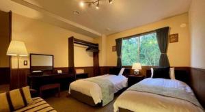 Postel nebo postele na pokoji v ubytování HAKUBA Moegi HOTEL + 138 fotografií