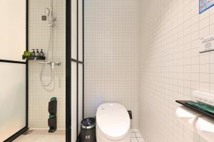 Photo de la galerie de l'établissement QiuGuo Hotel Chao He Beijing Dashilan Xijie Qianmen Subway Station Branch, à Pékin