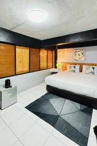 Postel nebo postele na pokoji v ubytování The Yak Cozy Chiang Mai