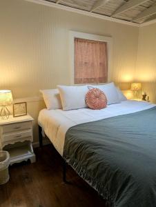 a bedroom with a large bed and a window at Secluded Mountain Cabin Retreat with Scenic Woodland Views near Black Mountain, NC in Montreat