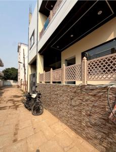 a motorcycle parked on the side of a building at Hotel Pratyaksh Darshan in Varanasi