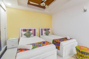 Postel nebo postele na pokoji v ubytování Hotel Pink Cozzy + 31 fotografií