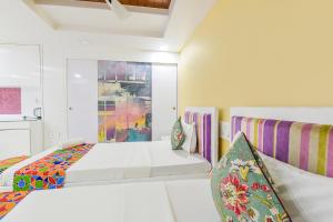 Postel nebo postele na pokoji v ubytování Hotel Pink Cozzy