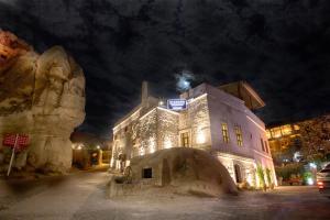 a building is lit up at night at Diamond of Cappadocia in Göreme