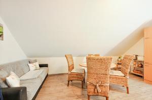 a living room with a couch and a table at Ferienwohnung KonradAlbrecht in Torgelow am See