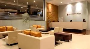 a living room with couches and chairs in a store at The Regent Ubon in Ban Na Khwai