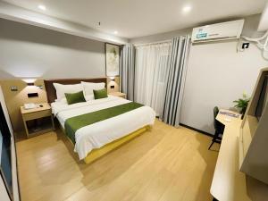 Postel nebo postele na pokoji v ubytování GreenTree Inn Anhui Suzhou Baima Mall Express Hotel