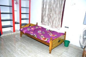 Ένα ή περισσότερα κρεβάτια σε δωμάτιο στο Shankara Homestay