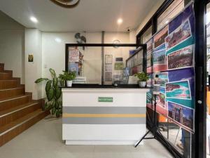 a lobby with a counter in a building at Marion's Inn Bldg 2 Bantayan powered by Cocotel in Bantayan Island