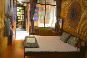 Postel nebo postele na pokoji v ubytování Tân Thanh Homestay & Restaurant Hòa Bình