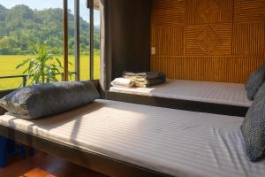 Postel nebo postele na pokoji v ubytování Tân Thanh Homestay & Restaurant Hòa Bình