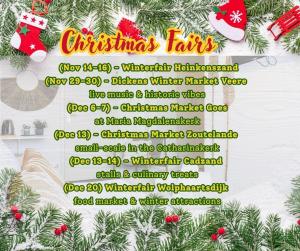 a christmas fair sign on a christmas tree at Stylish Suite Steps To Shore in Zoutelande