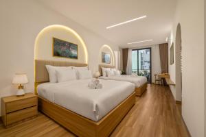 Postel nebo postele na pokoji v ubytování Azure Villa + 42 fotografií