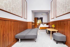 Postel nebo postele na pokoji v ubytování Sadec Bonsai Farmstay