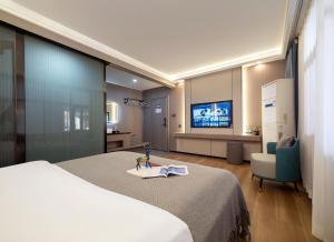 Μια τηλεόραση ή/και κέντρο ψυχαγωγίας στο Yiyun Residence