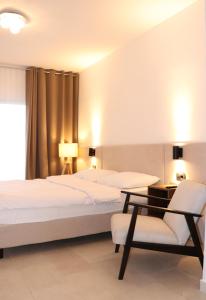 Postel nebo postele na pokoji v ubytování Rooms Vodisek - Depandansa Hotela Capris Capodistria Boutique + 17 fotografií