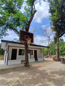 a basketball hoop in front of a house at correashomestay in Coron +13 photos