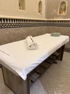 a table with a towel on top of it at Riad Citronnier & Spa in Fez