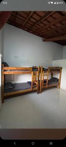two bunk beds are sitting in a room at Hostel coconut tree in Gokarna