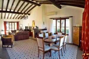 a living room with a table and a couch at La Cortijera in Benidoleig