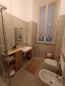 a bathroom with a sink and a toilet and a sink at Bogino 18 Apartment - Turin in Turin