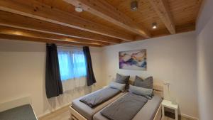 Postel nebo postele na pokoji v ubytování Pfeifers OdenwaldNest