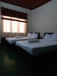 Postel nebo postele na pokoji v ubytování faith apartments