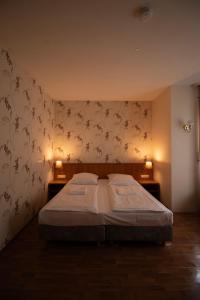 Postel nebo postele na pokoji v ubytování Villa Diana WestEnd