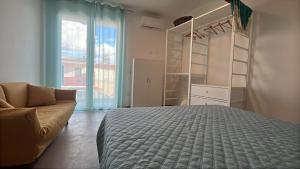 Ένα ή περισσότερα κρεβάτια σε δωμάτιο στο Casa Via Marconi