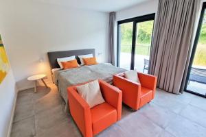 En eller flere senge i et værelse på Hello Zeeland - Babelweg 11 2p