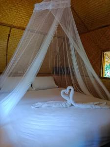 Postel nebo postele na pokoji v ubytování Paivana Khaosok Village