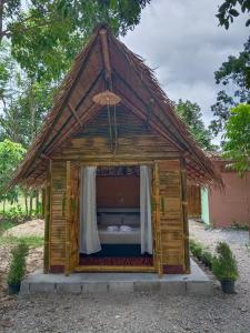 a small house with a thatched roof at Paivana Khaosok Village in Khao Sok +12 photos