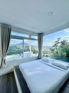 Postel nebo postele na pokoji v ubytování คารีโน่ เขาค้อ