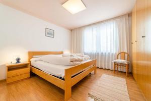 Giường trong phòng chung tại Appartamento Bernardi