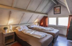 Ένα ή περισσότερα κρεβάτια σε δωμάτιο στο Bungalowpark Simpelveld - Delta 132