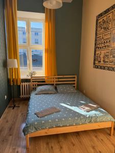 Postel nebo postele na pokoji v ubytování Oliwka Hostel