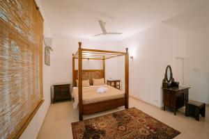 Postel nebo postele na pokoji v ubytování SkyPort Villa Negombo