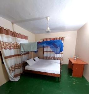 Postel nebo postele na pokoji v ubytování Flamingo Inn