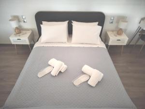 En eller flere senge i et værelse på Loft Suite