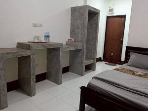 Ένα ή περισσότερα κρεβάτια σε δωμάτιο στο Ploy Chumpoo Lanta