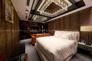 Postel nebo postele na pokoji v ubytování The Haron Hanoi Boutique Hotel + 19 fotografií