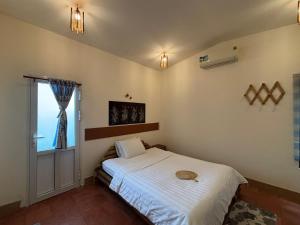 Ένα ή περισσότερα κρεβάτια σε δωμάτιο στο Coco Farmstay