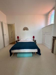 Ένα ή περισσότερα κρεβάτια σε δωμάτιο στο Appartement La parenthèse Arcachonnaise