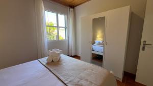 Postel nebo postele na pokoji v ubytování Domingos Reis